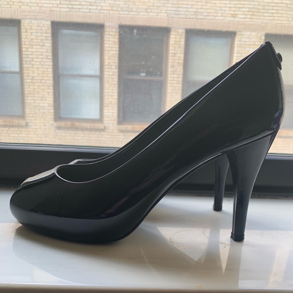 Stuart Weitzman black patent peep toe pumps